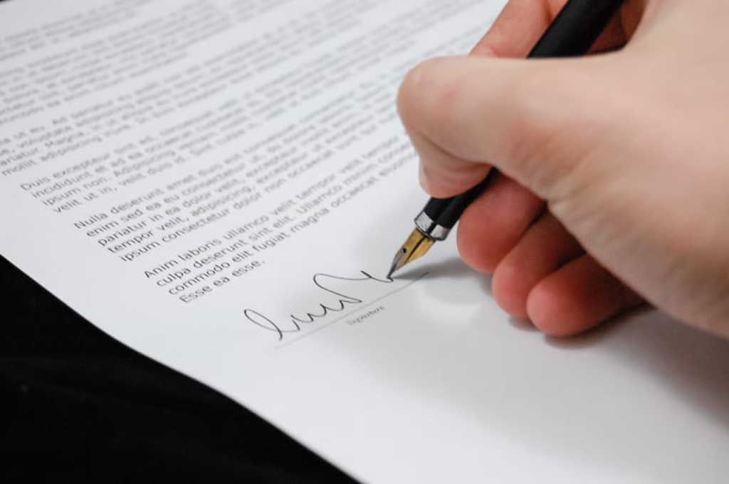hand signing legal document